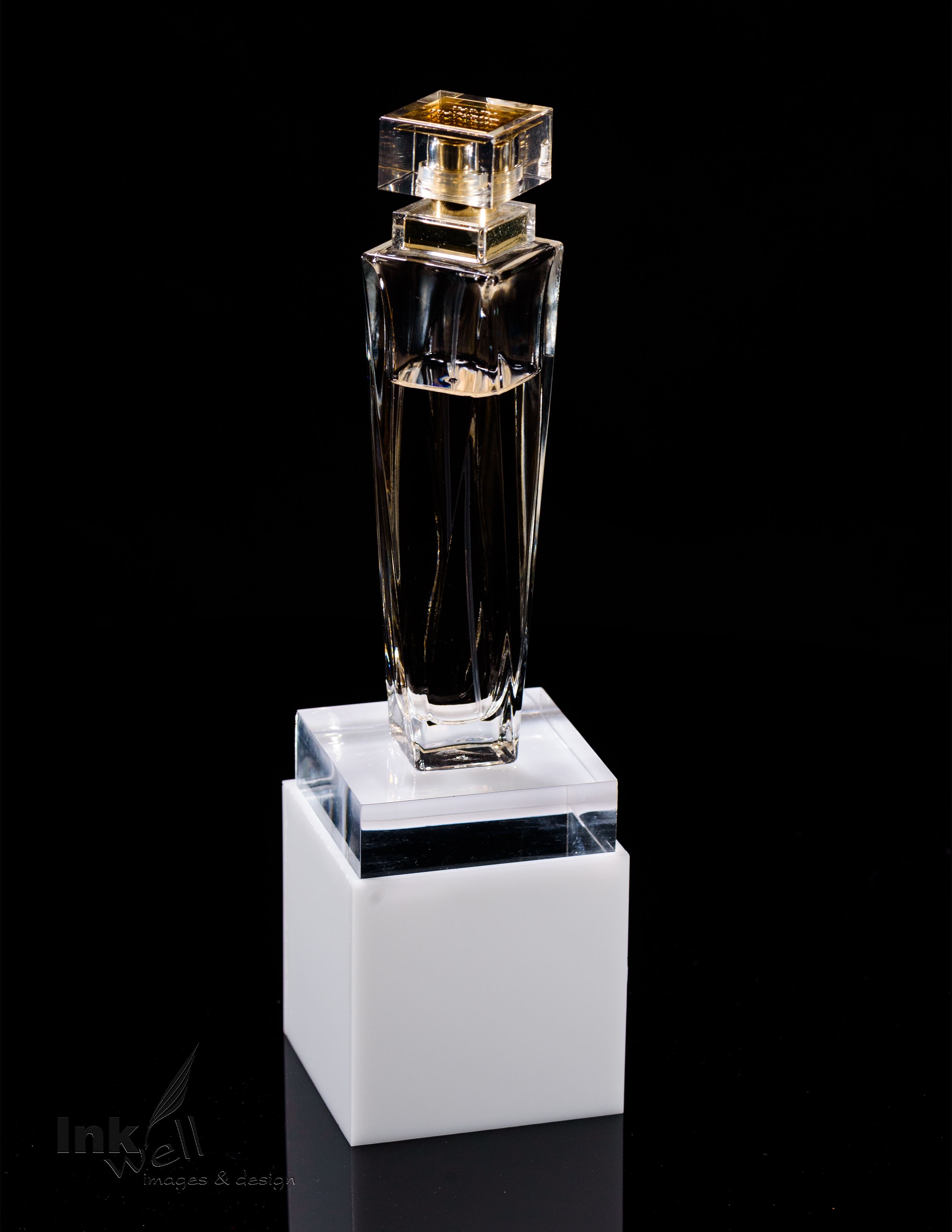 product photography, plexi glass stand with perfume bottle